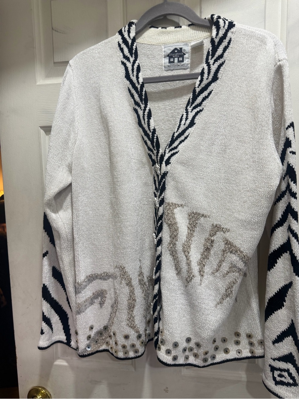Storybook Knits White Cardigan with Black Zebra Trim “Beaded Zebra”